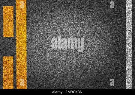Road Texture background with Yellow and white strip. Asphalt as abstract background or backdrop. Stock Photo