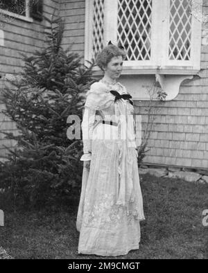 Young woman in America wearing a white, lace dress.
