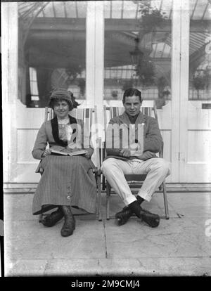Couple sitting in deckchairs Stock Photo