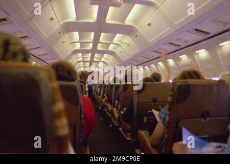 View of an aeroplane interior, with passengers, on a flight either to or from Corfu, Greece. Stock Photo