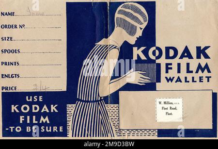 Photographic print wallet, advertising Kodak Film, and the developers, W. Million of Fleet Road, Fleet, Hampshire. The art deco design shows a young woman with bobbed hair, taking a photo with a box camera. Stock Photo