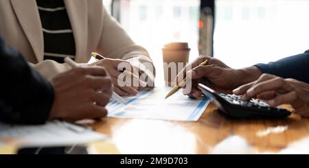 Accounting fund managers meeting to planning to improve quality next year team consultation investment stock market analysis and checking paperwork on Stock Photo