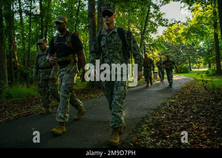 U.S. Service Members participate in the Ruck to Remember at Joint Base Charleston, South Carolina, May 17, 2022. The ruck was held in honor of the 32 Air Force Defenders, Navy Master at Arms and local Charleston law enforcement officers who were killed in the line of duty. Stock Photo