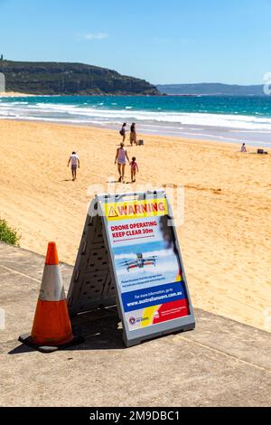 Palm Beach Sydney Australia surf rescue volunteers flying aerial UAV drones to spot and identify sharks in the ocean, warning signs advice, Sydney Stock Photo