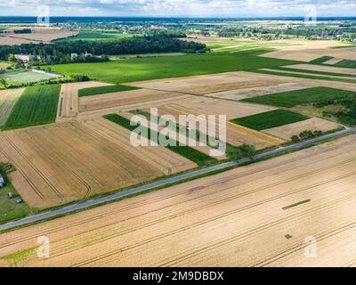 A drone shot of strips of farmland and meadows in Upper Silesia, Poland Stock Photo