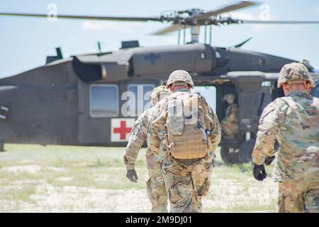 Members of the Idaho Army National Guard’s Headquarters and Headquarters Battery, 1st of the 148th Field Artillery Regiment conducted air medical evacuation and casualty treatment, along with members of Detachment 1, Company Golf, 1st of the 168th General Support Aviation Battalion at the Orchard Combat Training Center, May 17. Stock Photo