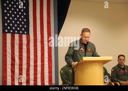 220517-N-ZZ999-1014 U.S. 5TH FLEET AREA OF OPERATIONS (May 17, 2022) Cmdr. Joseph Snyder, the commanding officer of the 'Grey Knights' of Patrol Squadron (VP) 46, deployed with Commander, Task Force (CTF) 57, addresses the Sailors of VP-46 during VP-46’s change of command ceremony, May 17. CTF 57 aircraft conduct missions in support of maritime operations to ensure security and stability in the Middle East region. Stock Photo