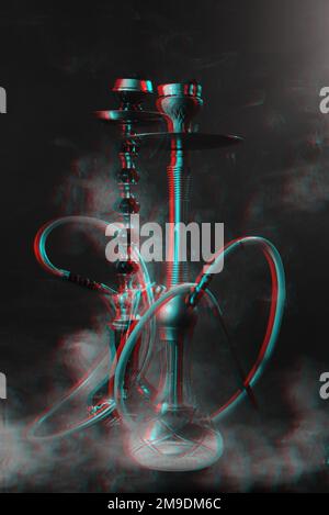 Hookah, shisha on smoky black background with smoke. Glitch, black and white. Stock Photo