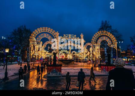 MOSCOW, RUSSIA - DECEMBER 23, 2016: Decorated new year's streets of Moscow at night with people Stock Photo