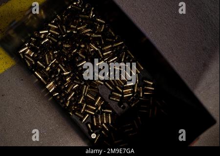Spent shell casings sit within an ammunition can in the Combat Arms ...