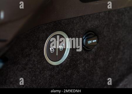 Rear seats folded. Rear seats easy fold down lever. New car inside. Stock Photo