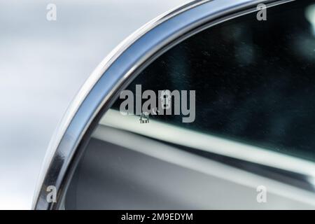 Rear view car mirror with collision avoidance system. Blind Spot Monitoring system. Stock Photo