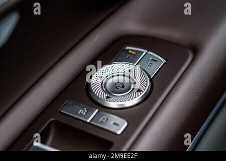 Side mirrors control panel on side door. Stock Photo