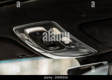 Car ceiling lamp in a car. Modern car interior lights close-up. Stock Photo