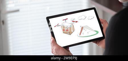Drone delivery concept shown on a tablet held by a man Stock Photo