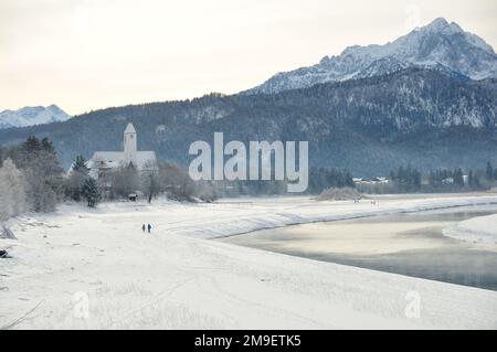 Walkers in the snowy landscape in Bavaria, Germany Stock Photo