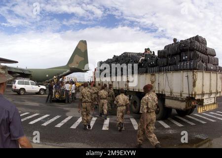 Straight on rear view medium as a Portugese Aircrew and local laborers load a vechicle and blankets onto a Portugese C-130 at the International Airport at Maputo, Mozambique, Africa on 17 March 2000. The aircraft and its crew are deployed to Maputo in support of Operation Atlas Response, a Humanitarian Aid Operation to help the people of Mozambique, after severe flooding (flooding and victims not shown) displaced over a million people from their homes. Subject Operation/Series: ATLAS RESPONSE Base: Maputo State: Inhambane Country: Mozambique (MOZ) Stock Photo