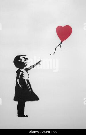 Barcelona- Spain Circa February 2022. Graffiti exposed at Banksy Exhibition at Barcelona Design Museum. Art piece called Girl with Balloon from 2004 Stock Photo