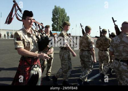 Members of the British Army march into the parade grounds for the start of CENTRASBAT (Central Asian Peacekeeping Battalion) 2000 opening ceremonies on September 13th, 2000. CENTRASBAT 2000 is a multi-national peacekeeping and humanitarian relief exercise sponsored by United States Central Command (U.S. CENTCOM) and hosted by former Soviet Republic Kazakhstan in Central Asia, Sep. 11-20, 2000. Exercise participants include approximately 300 U. S. troops including personnel from U.S. CENTCOM, from the U.S. Army's 82nd Airborne Division, Fort Bragg, North Carolina, and 5th Special Forces Group, Stock Photo