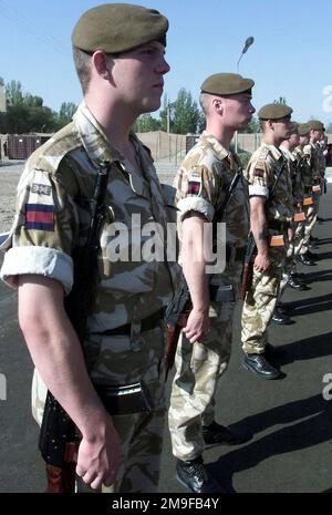 Members of the British Army march into the parade grounds for the start of CENTRASBAT (Central Asian Peacekeeping Battalion) 2000 opening ceremonies on September 13th, 2000. CENTRASBAT 2000 is a multi-national peacekeeping and humanitarian relief exercise sponsored by United States Central Command (U.S. CENTCOM) and hosted by former Soviet Republic Kazakhstan in Central Asia, Sep. 11-20, 2000. Exercise participants include approximately 300 U. S. troops including personnel from U.S. CENTCOM, from the U.S. Army's 82nd Airborne Division, Fort Bragg, North Carolina, and 5th Special Forces Group, Stock Photo