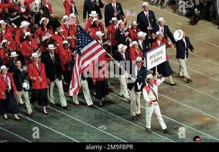 A high angle view looking down at the United States athletes as they enter Sydney's Olympic Stadium during opening ceremonies of the 2000 Olympic games. They received a warm welcome from the 110,000 people in attendance on September 15th, 2000. Fifteen US Military athletes are competing in the 2000 Olympic games as members of the US Olympic team. In addition to the fifteen competing athletes there are eight alternates and five coaches representing each of the four services in various venues. Base: Sydney State: New South Wales Country: Australia (AUS) Stock Photo