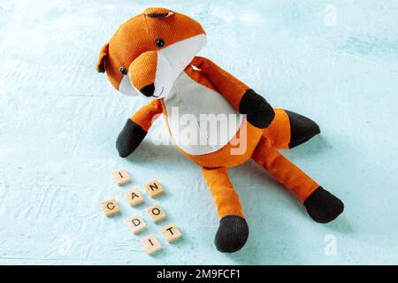 I can do it, motivational banner with a toy fox on a blue background, the concept of positive thinking Stock Photo