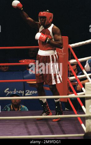 Left side front, medium shot of US Army STAFF Sergeant Olanda Anderson as he waves to the audience following his introduction during the second round of Men's Boxing at the 2000 Olympics, on September 24th, 2000, in Sydney, Australia. SSG Anderson is from the US Army's World Class Athlete Program. Base: Sydney State: New South Wales Country: Australia (AUS) Stock Photo