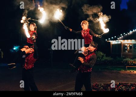 SEMIGORYE, IVANOVO OBLAST, RUSSIA - JUNE 26, 2018: Professional dancers men and women make a fire show and pyrotechnic performance at the festival wit Stock Photo
