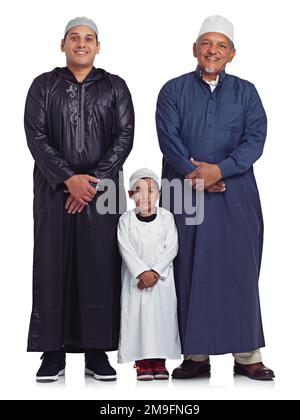 Muslim, family and portrait of men in studio for Islamic, prayer and bonding on white background. Islam, generation and mature man teaching prayer Stock Photo