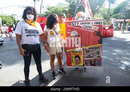 Brazilians protest carrying posters against the government of President Jair Bolsonaro in the city of Salvador, Bahia. Stock Photo