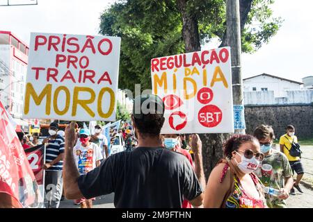 Brazilians protest carrying posters against the government of President Jair Bolsonaro in the city of Salvador, Bahia. Stock Photo