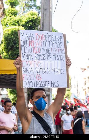 Brazilians protest carrying posters against the government of President Jair Bolsonaro in the city of Salvador, Bahia. Stock Photo