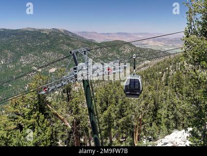 The Heavenly Gondola cable car travels 2.5 miles up the mountain from Heavenly Village Resort near South Lake Tahoe with veiws to Carson City Nevada. Stock Photo