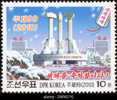 2010 North Korea stamp. New Year. Foundation of the Worker's Party of Korea monument in winter, Pyongyang Stock Photo