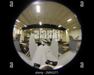 Fish eye lens view of aircraft from Carrier Airwing Three (CVW-3), embarked on board USS HARRY S. TRUMAN (CVN 75), are packed tightly into the hangar bay during the aircraft carrier's transit through the Suez Canal. Base: USS Harry S. Truman (CVN 75) Stock Photo