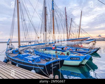 Tall ships at sunrise in Rosmeur Harbor in Douarnenez city, Finistere, Brittany, France Stock Photo