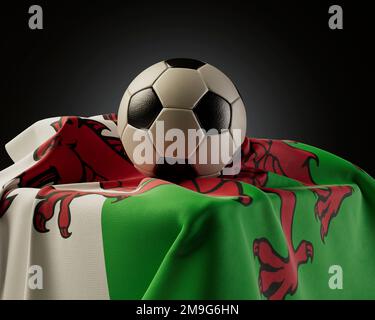A regular soccer balls resting on a Wales flag draped over a plinth on an isolated studio background - 3D render Stock Photo