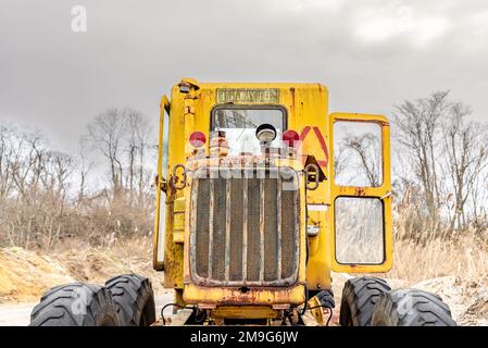 rear of an old used grader Stock Photo