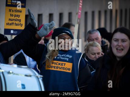 Mercy Mbuyongha, one of the striking nurses on a picket line outside the Royal Liverpool Hospital in the city centre of Liverpool. The nurses are members of the Royal College of Nursing, whose members are on strike today in England, Wales and Northern Ireland, as they demand a pay rise from their NHS employers. Around 250 nurses joined the action on three picket lines outside the hospital. Stock Photo