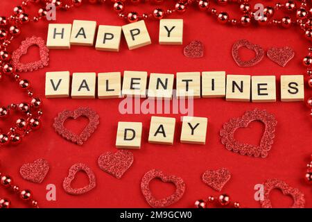 Valentines Day card. red hearts on a red background with text Happy Valentines Day Stock Photo