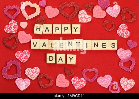 Valentines Day card. red hearts on a red background with text Happy Valentines Day Stock Photo