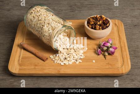 Rolled oats seeds spilled from the jar Stock Photo