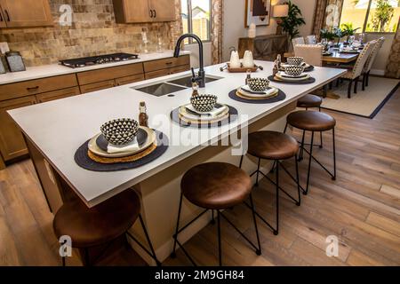 Kitchen Island Counter Top With Five Place Settings Stock Photo