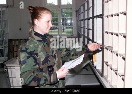 AIRMAN First Class Jessica Lorenc, USAF, 52nd Communications Squadron, 52nd Fighter Wing, Spangdahlem Air Base, Germany, sorts mail at the Eifel West Post Office on Spangdahlem's Bitburg Annex. Base: Bitburg Annex State: Rheinland-Pfalz Country: Deutschland / Germany (DEU) Scene Major Command Shown: USAFE Stock Photo