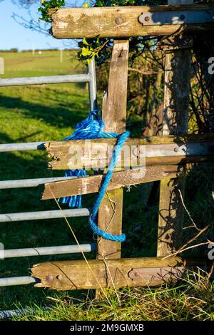 Fence and gate repairs on a famr in County Donegal, Ireland Stock Photo