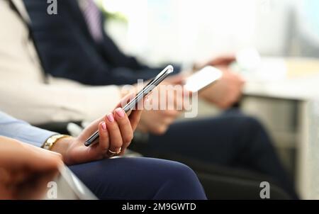 Closeup of business people hands are holding smartphone Stock Photo