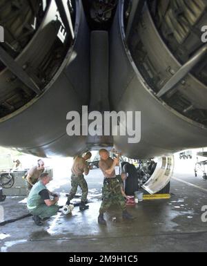 Air Force crewchiefs from the 28th Air Expeditionary Wing, service a B-1B Lancer bomber engine during Operation ENDURING FREEDOM. Air Force B-2 Spirit, B-1 Lancer, and B-52 Stratofortress, bombers expended more than 80 percent of the tonnage dropped on combat missions over Afghanistan to date. The Air Force flew more than 600 sorties including strike missions against al Qaeda and Taliban targets in Afghanistan. These targets include early-warning radar systems, ground forces, Command-and-Control facilities, al Qaeda infrastructure, airfields and aircraft. Operation ENDURING FREEDOM is in suppo Stock Photo