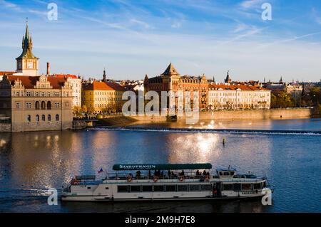 Tourboat on Vltava river at sunset, Prague, Czech Republic Stock Photo