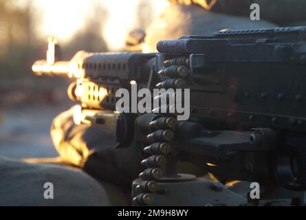 Close up of a frosty M-240B Machine Gun manned by US Marine Corporal Markeath Evans, a member of Engineer Platoon, 26th Marine Service Support Group, 26th Marine Expeditionary Unit (Special Operations Capable) standing guard at the front gate of the forward operating base located at Kandahar International Airport, Kandahar, Afghanistan, during OPERATION ENDURING FREEDOM. Subject Operation/Series: ENDURING FREEDOM Base: Kandahar International Airport Country: Afghanistan (AFG) Scene Major Command Shown: 26th MEU (SOC) Stock Photo