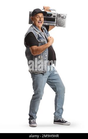 Full length shot of a happy mature man standing and holding a boombox radio on his shoulder isolated on white background Stock Photo